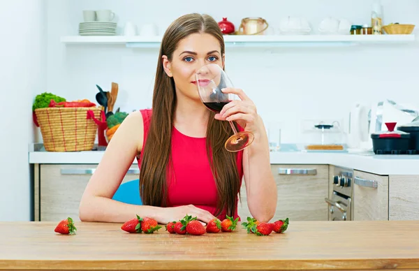 Woman drinks red wine alone