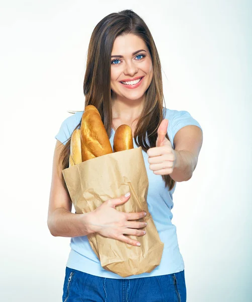 Woman holding paper bag with bread — Stock Photo, Image