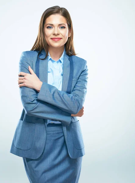 Mujer de negocios en traje de pie con los brazos cruzados —  Fotos de Stock