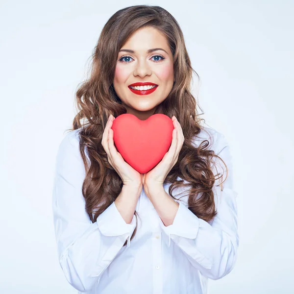 Smiling woman holding red heart — Stock Photo, Image