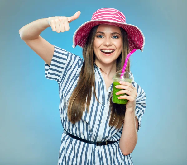Smiling woman holding smoothie drink