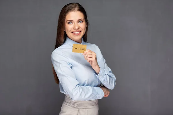 Woman holding gold credit card — Stock Photo, Image