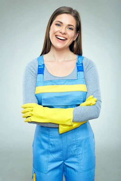 Smiling woman builder wearing overalls standing with crossed arm — Stock Photo, Image