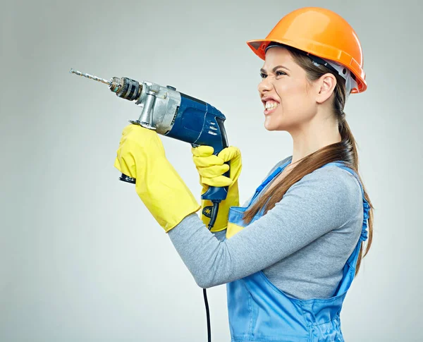 Hard work of woman builder with drill tool. — Stock Photo, Image