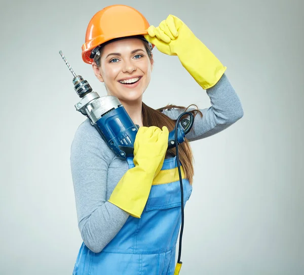 Woman builder holding drill tool — Stock Photo, Image