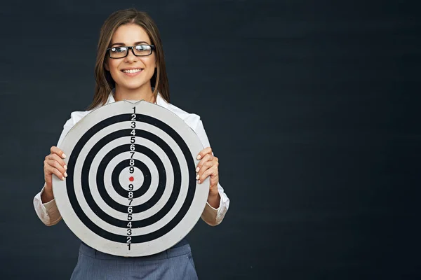 Smiling business woman holding black white target. — Stock Photo, Image