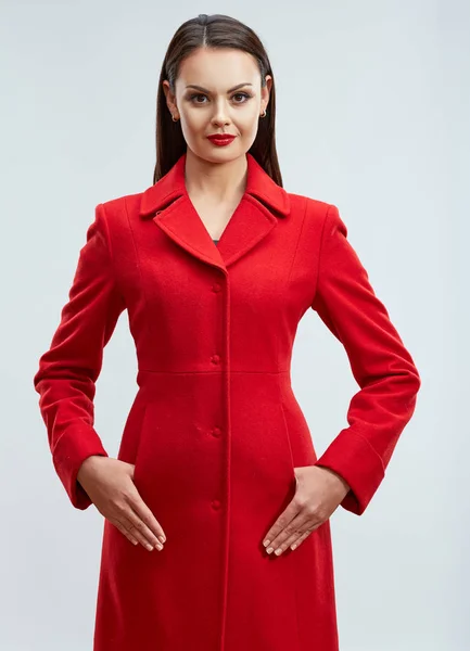 Young woman in warm red coat — Stock Photo, Image