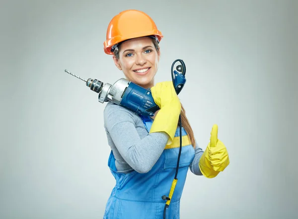Builder kobieta trzyma narzędzia Wiertarka — Zdjęcie stockowe