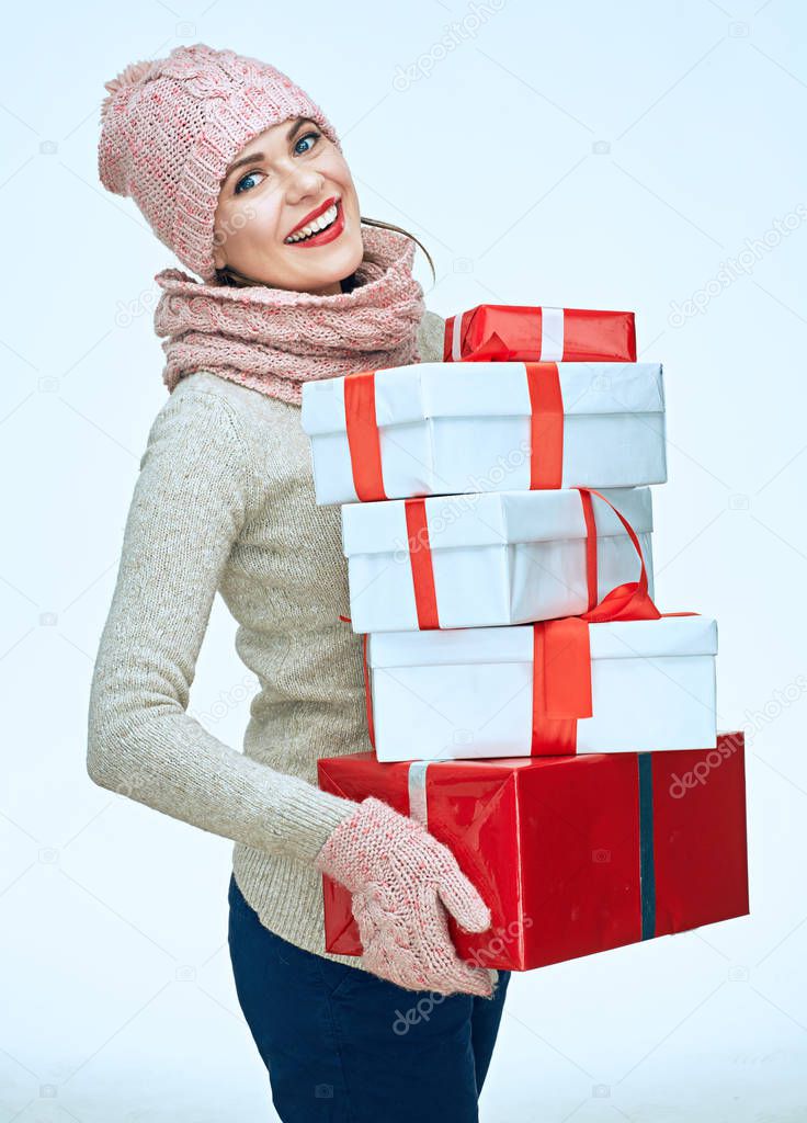 Smiling woman holds bunch of gifts