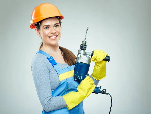 Builder kobieta trzyma narzędzia Wiertarka — Zdjęcie stockowe