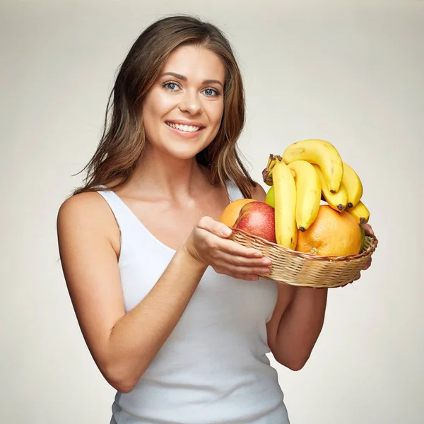 Woman holding basket with healthy food — Stock Photo, Image