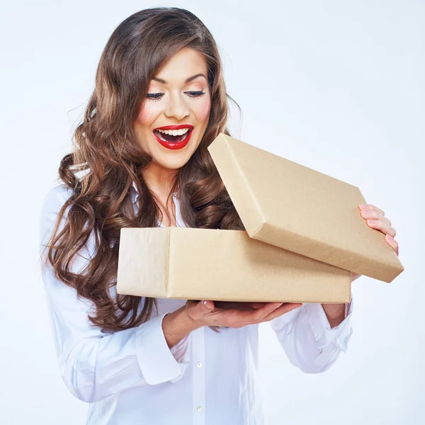 Young woman looking into open box. Long curly hair — Stock Photo, Image