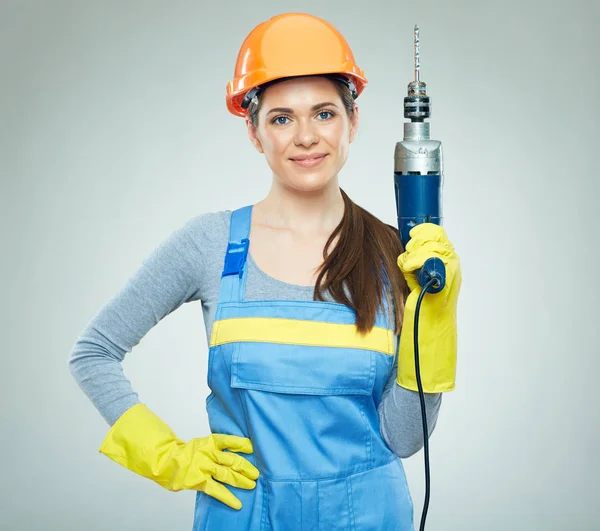 Woman builder holding drill tool — Stock Photo, Image