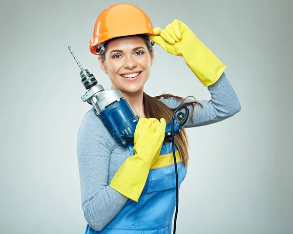 Kobieta budowniczy z narzędziem wiertarskim — Zdjęcie stockowe