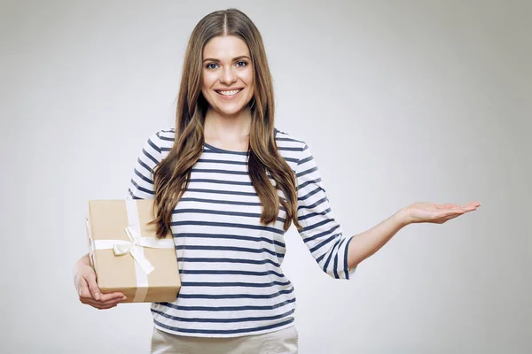 Woman in warm clothes holding box — Stock Photo, Image