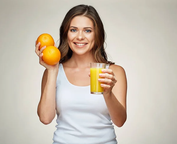Woman holds fruit and juice. vitamin drink. — Stock Photo, Image