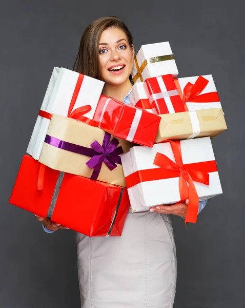 Business woman holding pile, stack, heap of presents — Stock Photo, Image