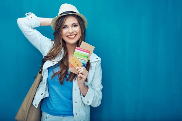 Woman holding passport with cards and ticket — Stock Photo, Image