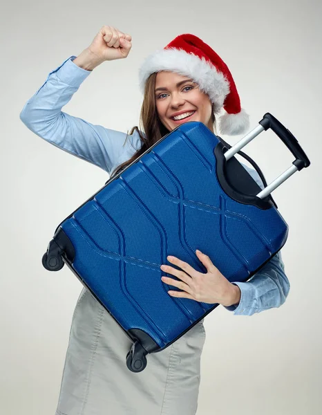 seyahat çantası elinde Noel şapka giyen neşeli kadın 