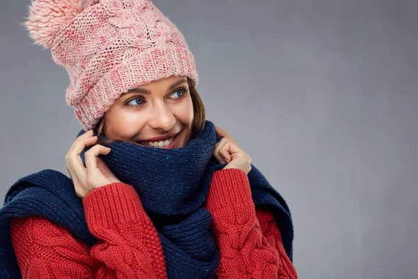 Close up face portrait of smiling woman wearing winter warm clot