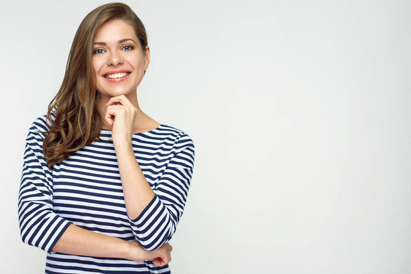 Portrait of thinking woman isolated on white back. Casual striped shirt.