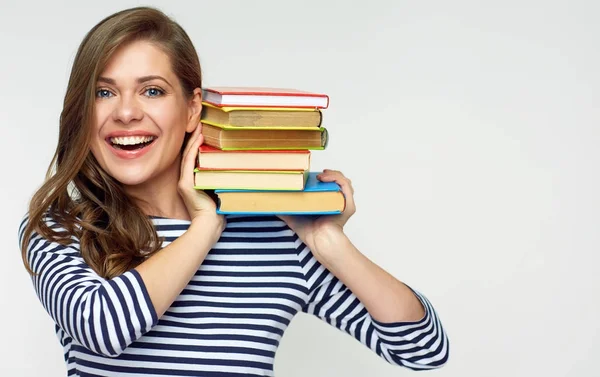Girl student holding pile of books. — Stock Photo, Image