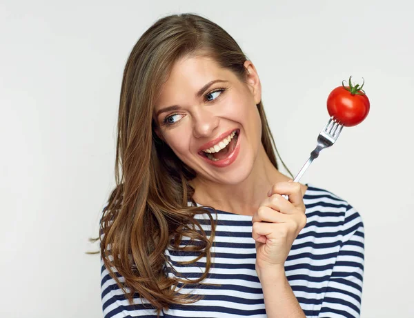 Happy woman holding fork with tomato. — Stock Photo, Image