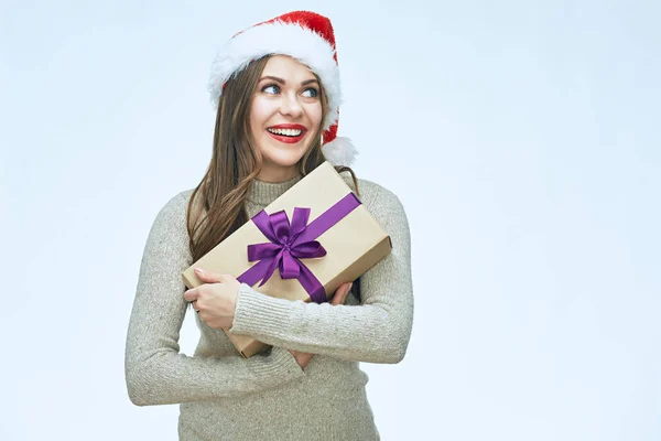Casual Dressed Smiling Woman Wearing Santa Hat Holding Christmas Gift — Stock Photo, Image