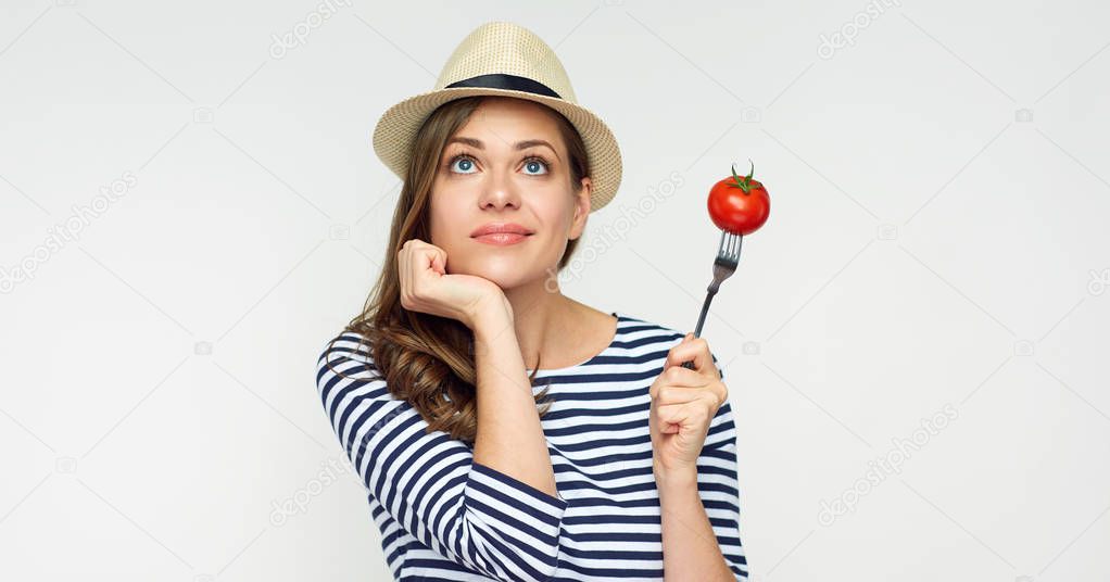 Woman thinking about vegetable diet.