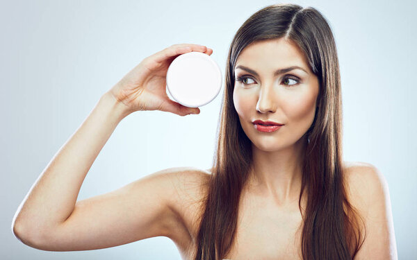 portrait of young woman holding jar face anti wrinkles cream 