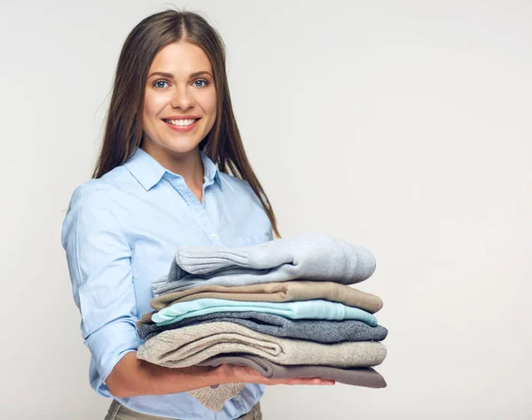 Smiling Woman Holding Stack Warm Winter Clothes — Stock Photo, Image