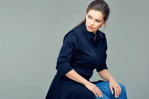 Beautiful young woman dressed in black shirt dress. — Stock Photo, Image