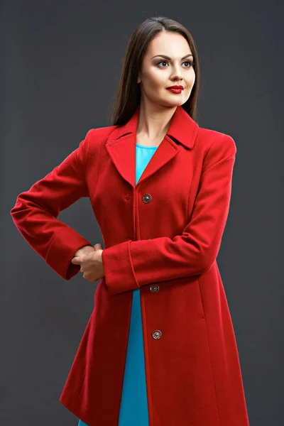 Model in red coat and blue dress — Stock Photo, Image