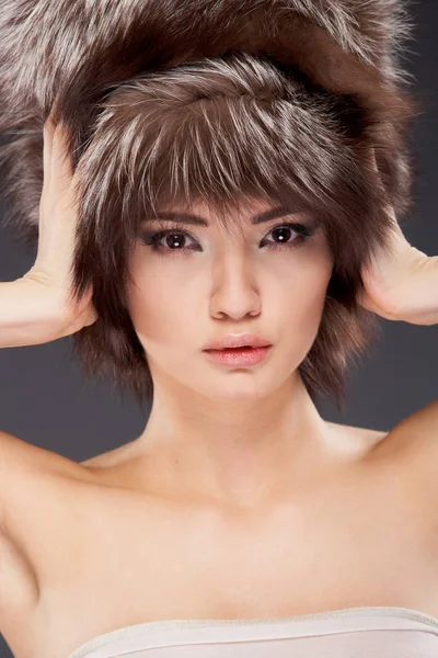 Attractive Young Woman Wearing Fur Hat Looking Camera Gray Background — Stock Photo, Image