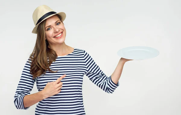 Smiling Woman Holding Empty White Plate Pointing Finger — Stock Photo, Image