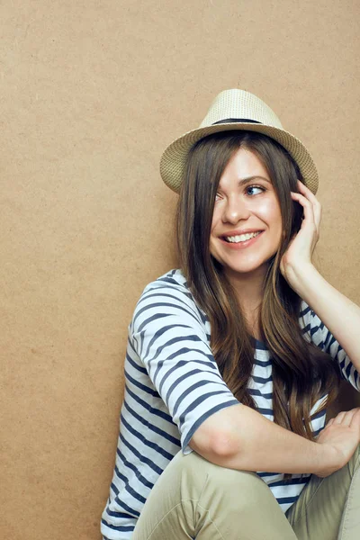 Portrait Young Smiling Woman Wearing Hat Sitting Light Wall — Stock Photo, Image