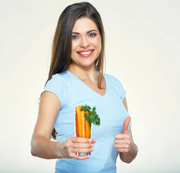 Smiling woman holding carrot showing thumb up — Stock Photo, Image