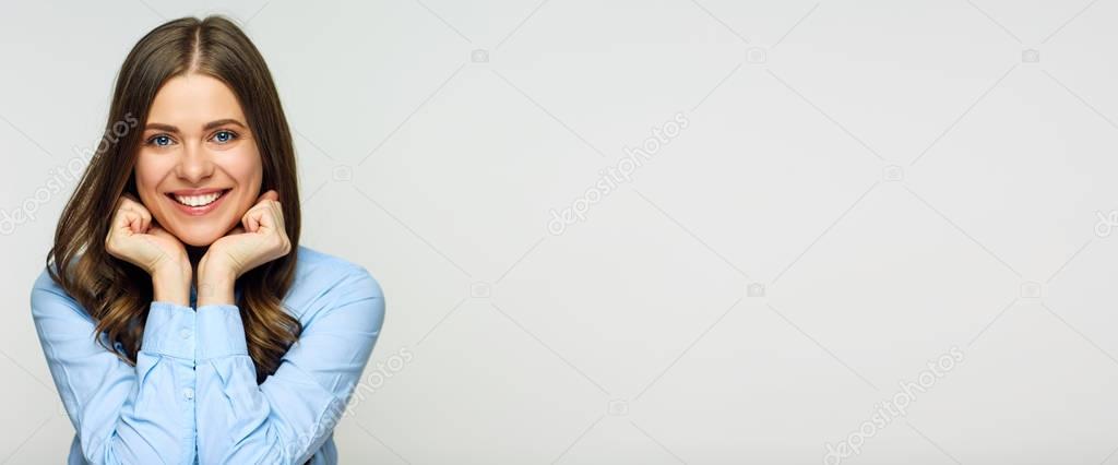 smiling woman touching face with hands and looking at camera isolated on white background