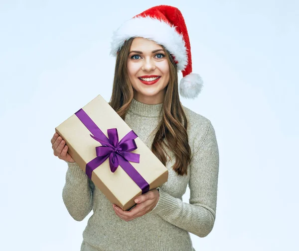 Casual Dressed Smiling Woman Wearing Santa Hat Holding Christmas Gift — Stock Photo, Image