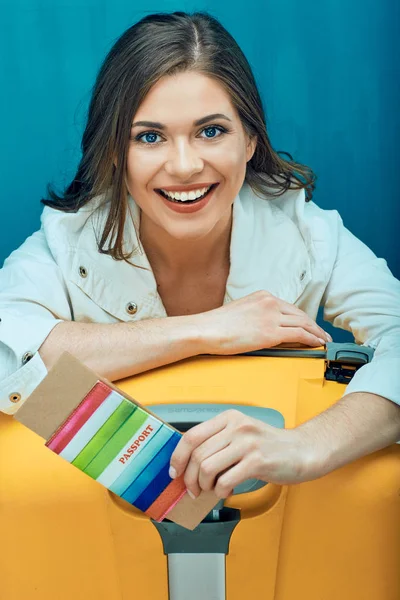 Close up smiling face portrait of young woman holding passport w — Stock Photo, Image