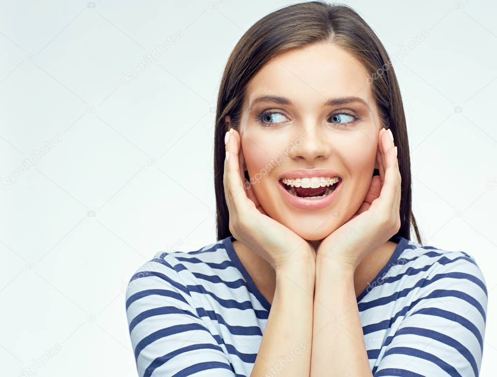 happy smiling woman with braces touching face and looking side, health concept  