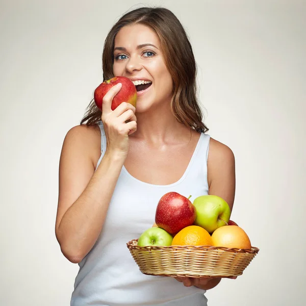 Smiling woman eating apple. isolated studio portrait. — Stock Photo, Image