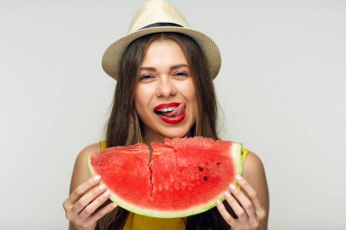 smiling woman showing tongue out holding big slice of watermelon, concept of vitamin summer diet  clipart
