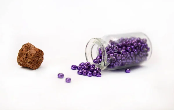 Lilac Beads in bottle with cork — Stock Photo, Image