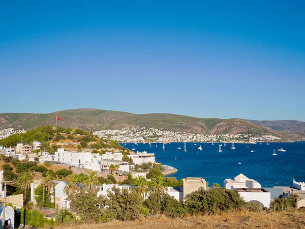 View of Bodrum Bay and hill with national flag of Turkey. — Stock Photo, Image