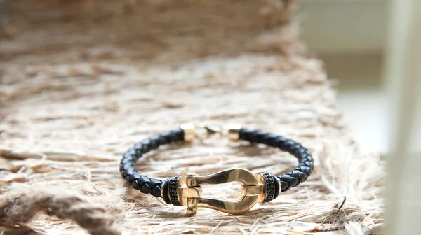 Gold and leather bracelet