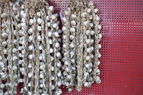 Braids of garlic hanging — Stock Photo, Image
