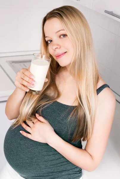 Pregnant woman with milk — Stock Photo, Image