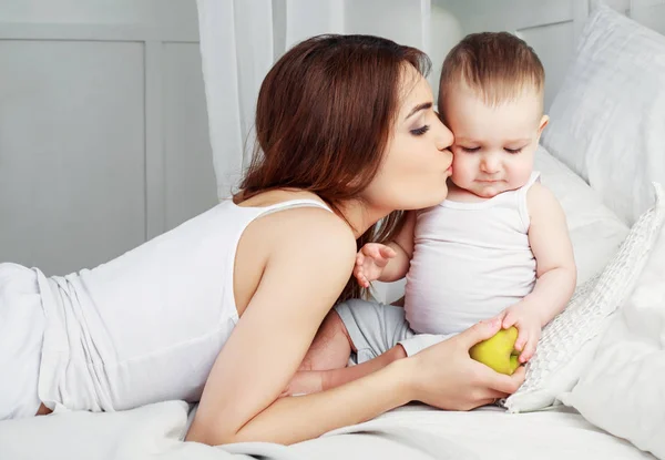 Mother kissing her baby — Stock Photo, Image