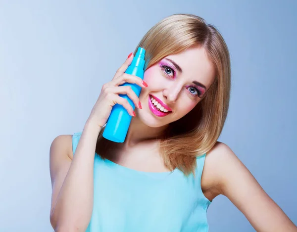 Woman with a hair spray — Stock Photo, Image